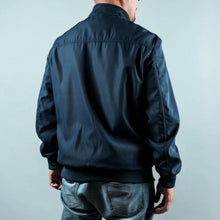 Load image into Gallery viewer, Man wearing a navy sports jacket from behind